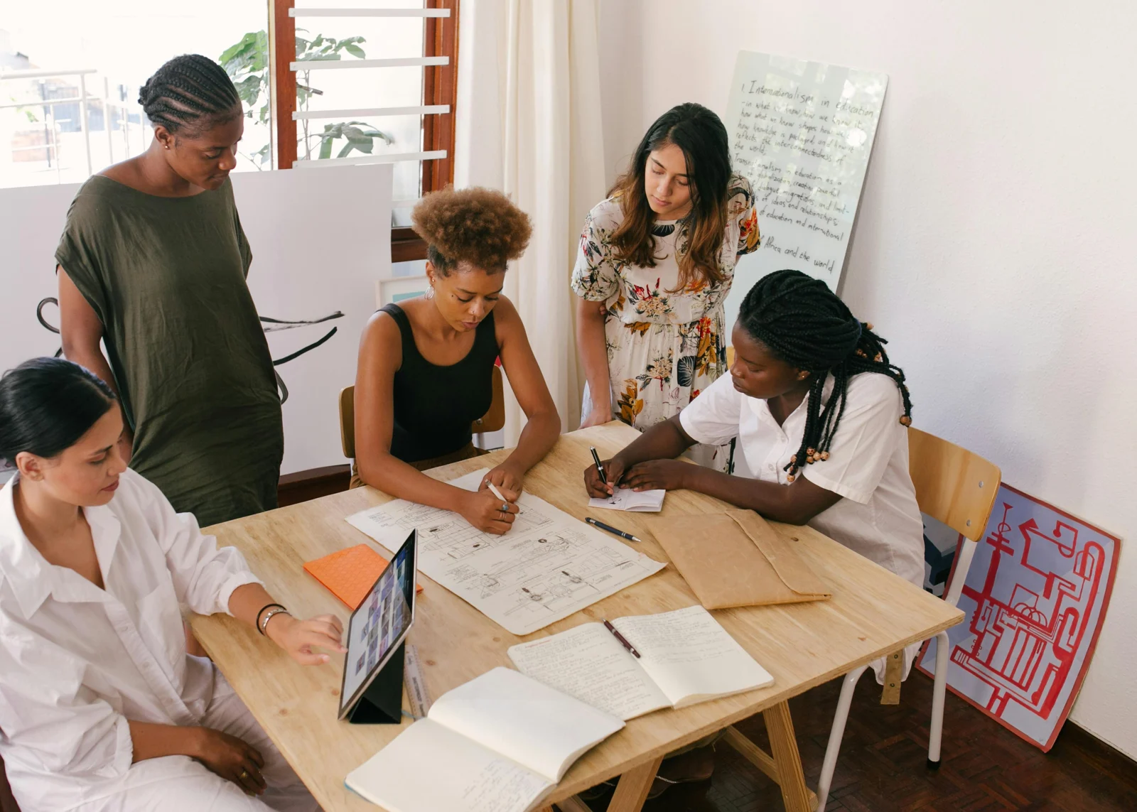 People collaborating on a project around a table